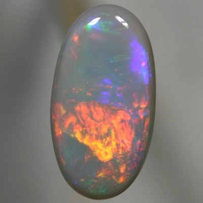 SOLID SEMI BLACK OPAL Rolling flashes of red and neon orange to magenta and purple